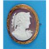 Image 1 : A Victorian shell cameo brooch, carved with a classical female profile, in an engraved gold frame...