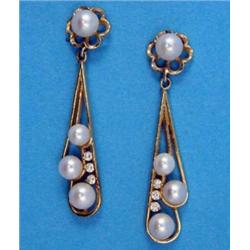 A pair of modern gold drop earrings, set cultured pearls and small diamonds...