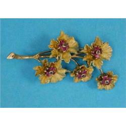 A Bulgari 18k gold floral spray brooch, each of the five flowerheads set with a ruby and sapphire...