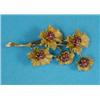 Image 1 : A Bulgari 18k gold floral spray brooch, each of the five flowerheads set with a ruby and sapphire...