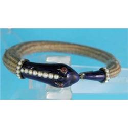 An early Victorian woven hair bracelet, with blue enamel snakes head clasp, set split pearls and...