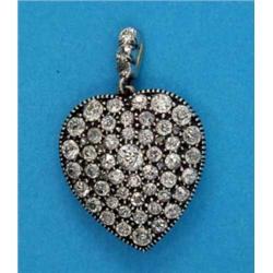 A late Victorian gold heart shape pendant, pave-set old brilliant cut diamonds...