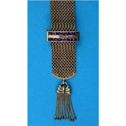 A 9ct gold wide band flexible 'woven' link bracelet, the clasp set 2 rows of amethysts, gross wei...