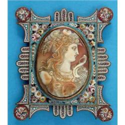 A 19th century oval shell cameo, carved with a study of Diana, mounted in a floral micro mosaic e...
