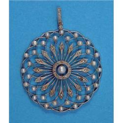 An Edwardian circular openwork flowerhead pendant, set rose cut diamonds and pearls, 1¾ins diamet...