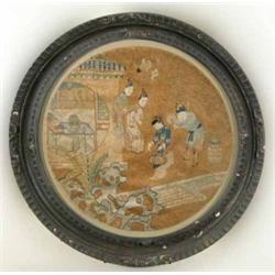A 19th century Chinese circular panel, worked with 4 figures in an interior and garden landscape,...