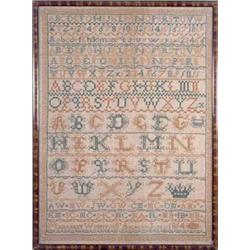 A sampler worked with the alphabet, numerals, initials and pattern bands within a key border, in...