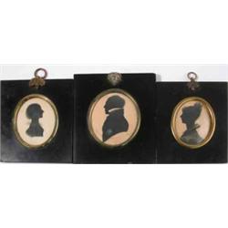 Victorian School three painted silhouettes, Admiral Sir Thomas Collier and two ladies, Ovals, lar...