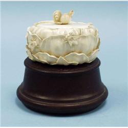 An antique Japanese carved ivory covered box....