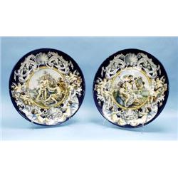 A pair of large antique Italian faience charg...