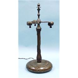 LOUIS COMFORT TIFFANY - A signed bronze lamp...