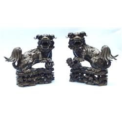 A pair of large antique Chinese brown patinat...