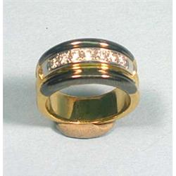 An 18 kt. two-tone gold and diamond band ring...