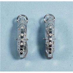 A pair of unusual 18 kt. white gold and diamo...