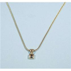 A 1960's 18 kt. gold pendant with matching ch...