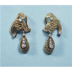 A pair of 18 kt. yellow gold and diamond earr...