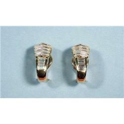 A pair of geometrical design 18 kt. gold earr...