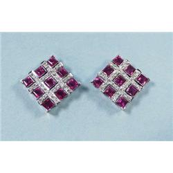 A pair of 18 kt. white gold, ruby and diamond...