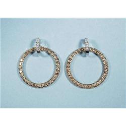 A pair of 18 kt. yellow and white gold hoop e...