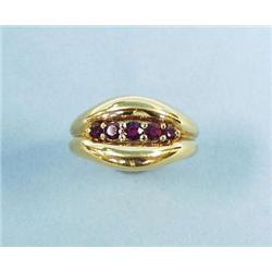 CHAUMET - PARIS - An 18 kt. gold and ruby ban...