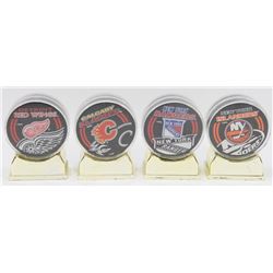 4 VARIOUS COLLECTORS HOCKEY PUCKS