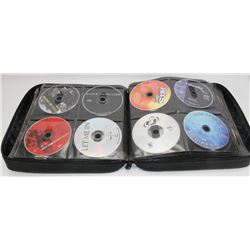 BINDER OF OVER 90 CD'S  MOVIES