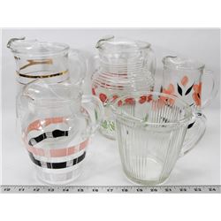 8) 5 PITCHERS IN DIFFERENT SIZES.