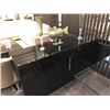 Image 2 : BLACK AND CLEAR GLASS TOP FORMAL DINING ROOM TABLE WITH 4 TAN LEATHER CHAIRS.