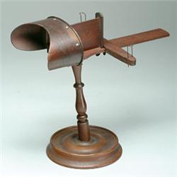 Stereographic Viewer, A cherry wood tabletop stereographic viewer [sold with] 6 various stereov...