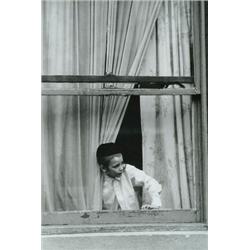 Gandard, Pierre, ORTHODOX BOY IN WINDOW, a mounted black and white photograph taken in Montreal...