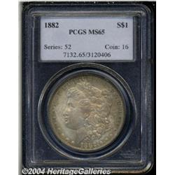 1882 S$1 MS65 PCGS. Medium golden toning with