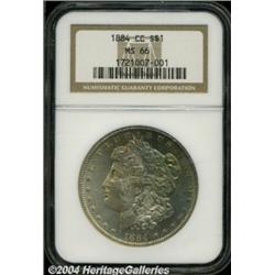 1884-CC S$1 MS66 NGC. Gold, orange, teal, and
