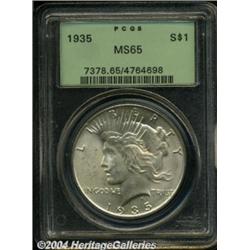 1935 S$1 MS65 PCGS. A light film of gold