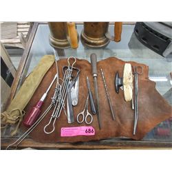 Assorted Tools With Leather Piece