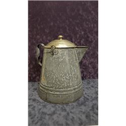 Granite-ware camp coffee pot, with old time coffee grounds