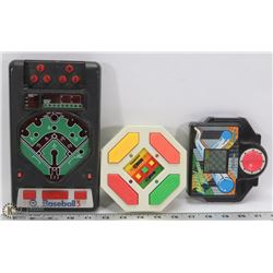 THREE ASSORTED VINTAGE HAND HELD ELECTRONIC GAMES