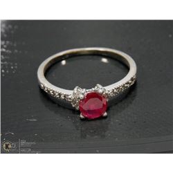 .925 SILVER RING W/CZS AND PINK STONE -