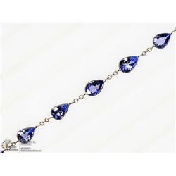 50) 10K WHITE GOLD 12 TANZANITE BRACELET