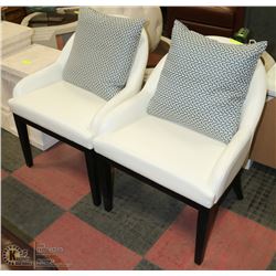 SHOWHOME PAIR OF WHITE LEATHERETTE SIDECHAIRS
