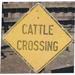 wooden cattle crossing sign
