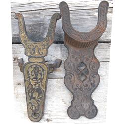 2 antique ornate iron bootjacks