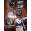 Image 2 : LOT OF COLLECTIBLE VANCOUVER CANUCKS HOCKEY PUCKS