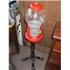 Image 1 : 1 RED BUBBLE GUM MACHINE ON BLACK METAL STAND
