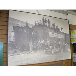 1 LARGE WALL MOUNT PICTURE OF KELOWNA RAILYARD WITH CAPTION "PACKED BY THE KELOWNA BOARD OF TRADE EX