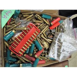 box of assorted brass shotgun shell hulls and some live ammunition