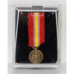 USA NATIONAL DEFENSE MEDAL WITH RIBBON IN CASE.