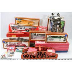BOX WITH HORNBY COLLECTABLE TRAIN TRACKS AND TYCO