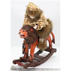 ANCIENT MAN RIDING ROCKING LION FIGURINE