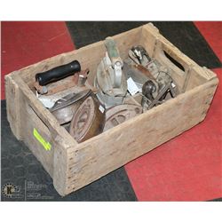 CRATE WITH ANTIQUE IRONS, IRON BASES, AND PLANE