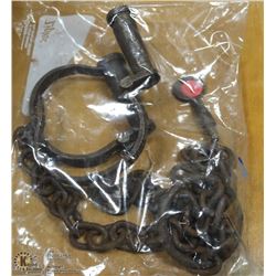 129) ANTIQUE IRON LEG SHACKLES WITH KEY